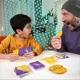 A dad and kid mid-game, cracking up