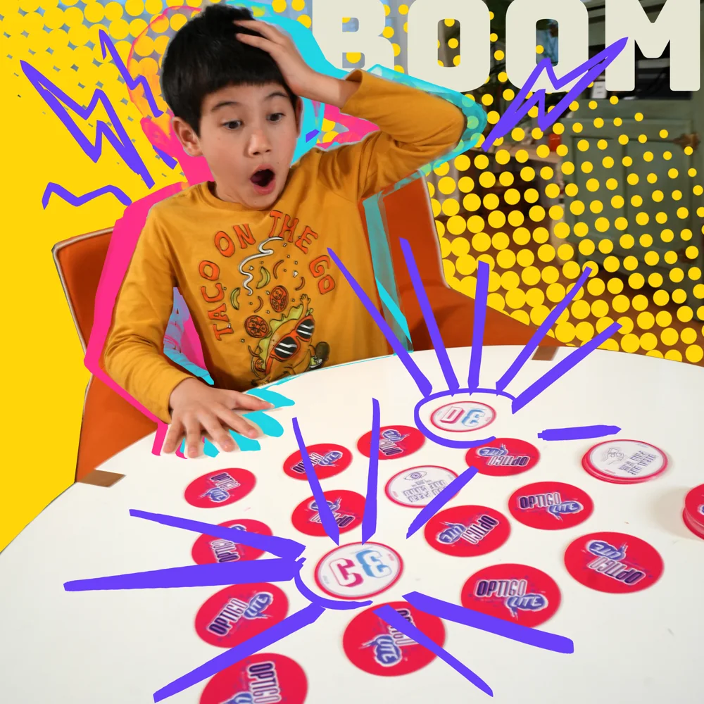 A kid mid-BOOM over a table of OPTIGO Lite discs